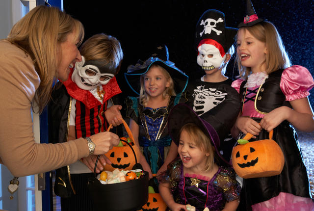 Happy Halloween party with children trick or treating